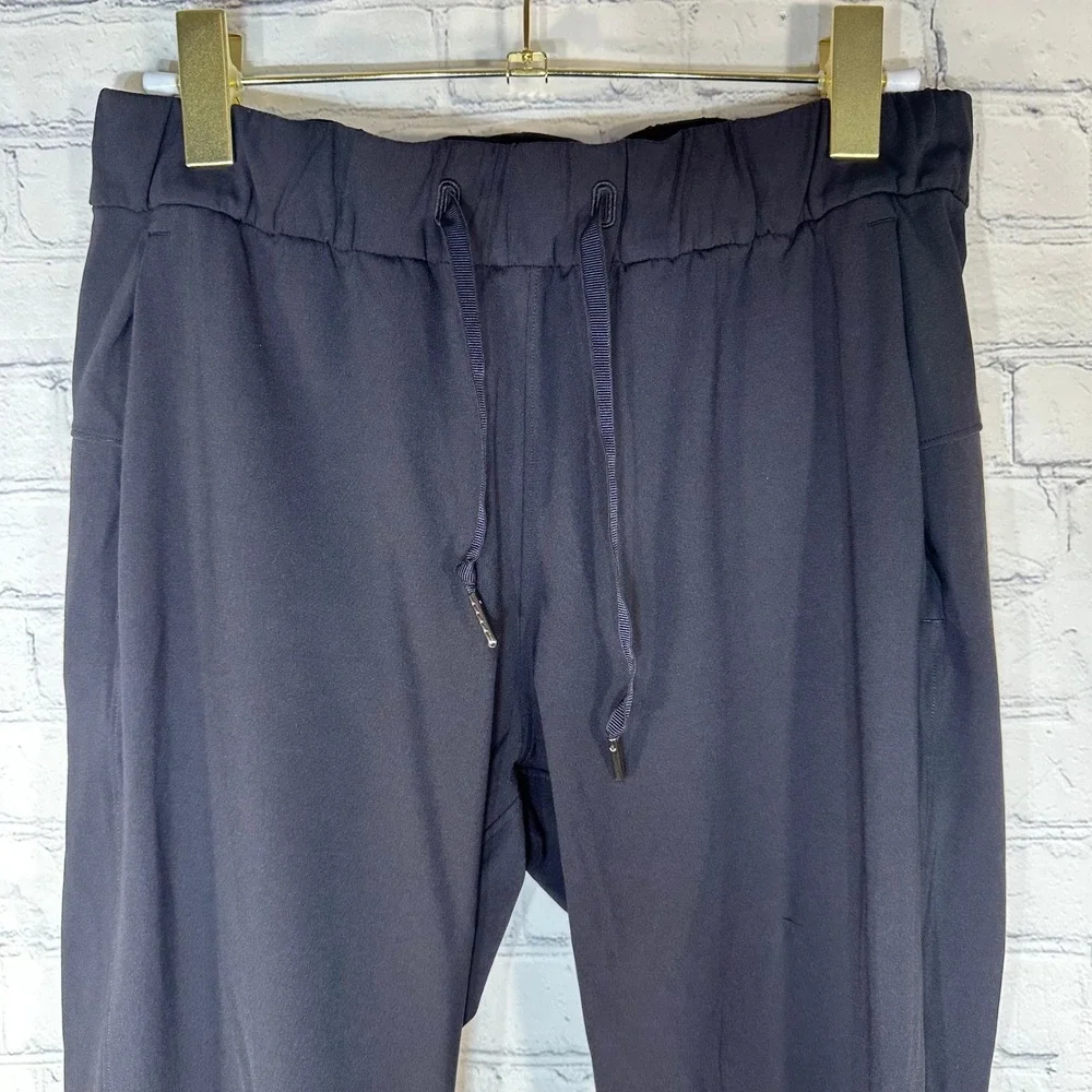 Lululemon On the Fly 7/8 Tapered Pant Black Luxtreme Jogger Size 6 LW5ATES